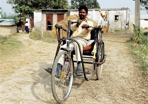 A hand-powered tricycle for a disabled person